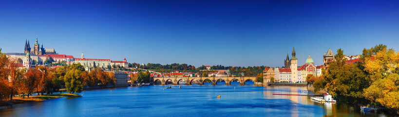 Fototapeta premium Prague Castle and Old City day panorama view with blue sky, travel vivid autumn european background