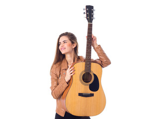 Fototapeta premium Young woman holding a guitar 