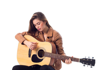 Fototapeta premium Young woman holding a guitar 
