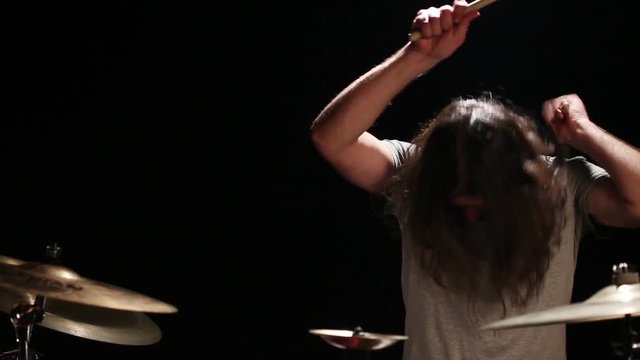 Bearded drummer playing drums