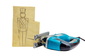 Piece of wood with a pencil drawing of a soldier and jigsaw