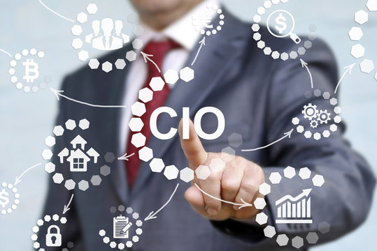 CIO or chief information officer concept presented by businessman touching on virtual screen. career in IT information technology officer to administrator staff. Chief Investment Officer acronym.