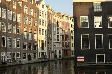 Fototapeta na wymiar Canal in Amsterdam in a beautiful spring day. Amsterdam is the capital and the most populous city of the Netherlands on Amsterdam, Netherlands