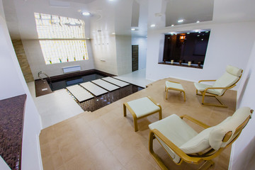 Interior of sauna with a swimming pool and a place to relax