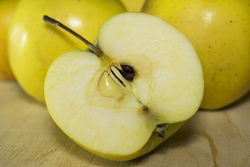 green apples on a wooden texture