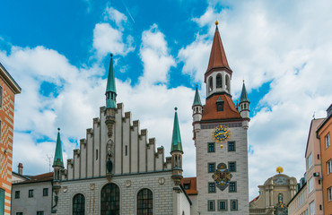 Obraz premium old townhouse of munich with colorful sky and clouds