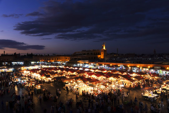 Food stalls at sunset on the Djemaa El Fna square, Morocco, Africa
