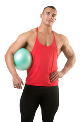 Fit Man Standing Holding a Pilates Ball