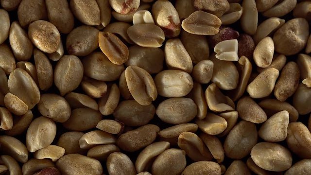 Close up of shelled peanuts rotating.