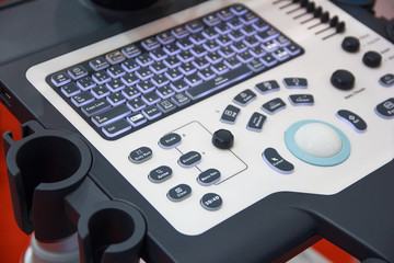 Keyboard controls and medical equipment closeup. Medicine