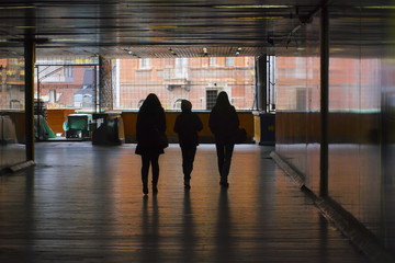 Silhouettes in the underground passage 