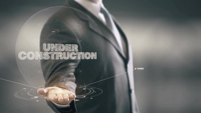 Under Construction Businessman Holding in Hand New technologies