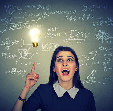 smart student with idea light bulb maths and science formulas on background