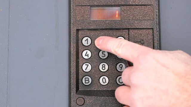 The modern digital intercom system mounted outdoors