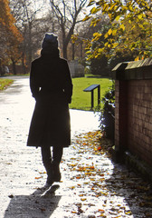 Girl walking in the park, Autumn.