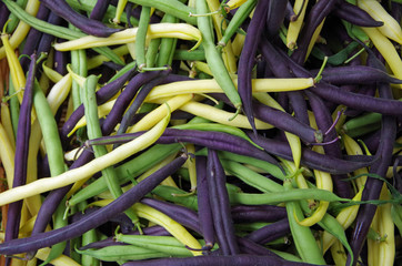 Mixed yellow purple green raw string bean pile view from above