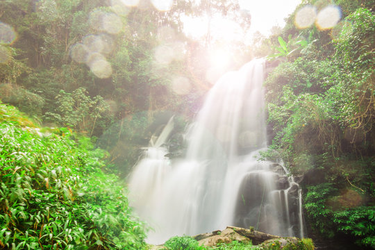 The water fall in the big national park in Thailand by the slow shutter speed to have a nice soft picture style with flare.
