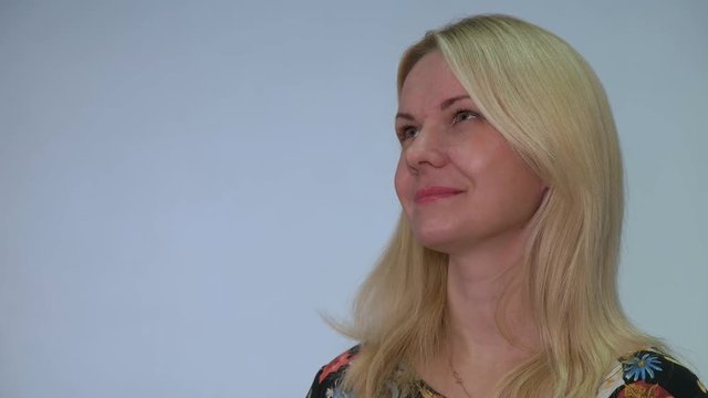 Girl with a microphone picks up an interview or asks questions