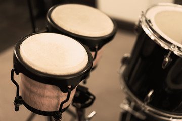Fototapeta na wymiar Black drum made of wood in the rehearsal room's floor in old pai