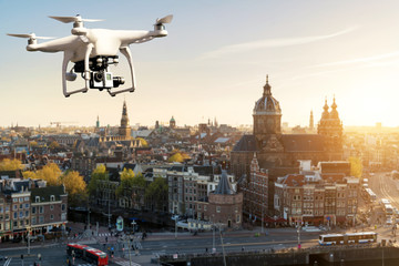 Drone with high resolution digital camera flying over Amsterdam