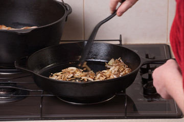 Chopped brown onions frying