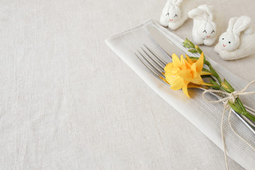 yellow flowers and bunny rabbit, Easter table setting copy space
