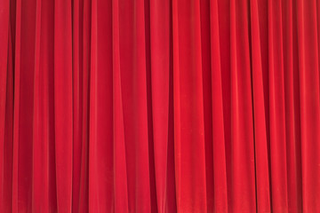 Red velvet curtain backdrop on the stage.