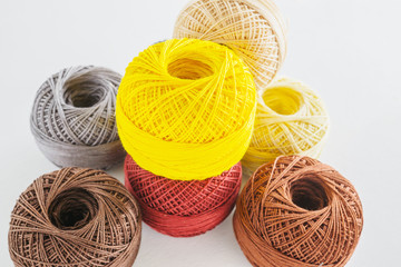 Piles of multicolored balls yarn background