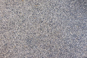 Patterned wall made of small stones.