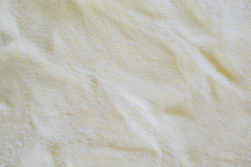 fiber fabric texture background in cream color tone. fabric uneven