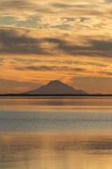 Mt. Redoubt and Skilak Lake at sunset in Alaska.