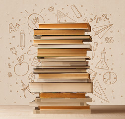 A pile of books on table with school hand drawn doodle sketches