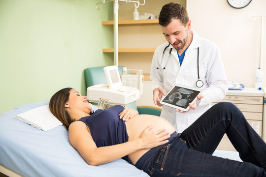 Doctor showing ultrasound on a tablet