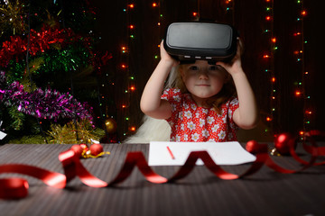 The girl received a Christmas present virtual glasses