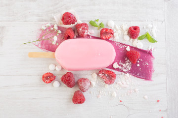 Fototapeta na wymiar Raspberry ice cream on wooden table 