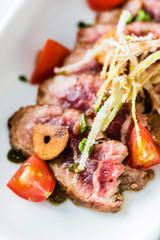  beef with vegetable garnish