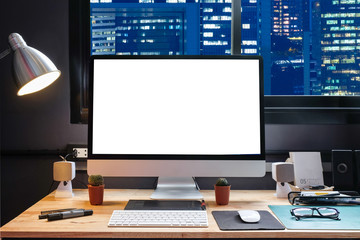 Naklejka premium Graphic designer's workspace with city night view 