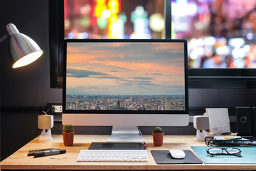 Naklejka premium Graphic Designer Workspace equipped with pen, tablet, computer and sunglasses