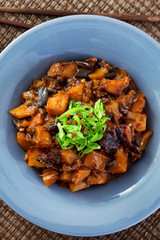 Asian vegetarian meal with potatoes and eggplants. Shot from abo