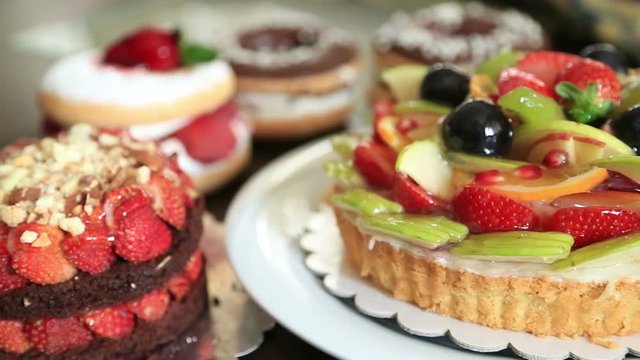 Delicious tart with fresh fruits cakes and donuts 