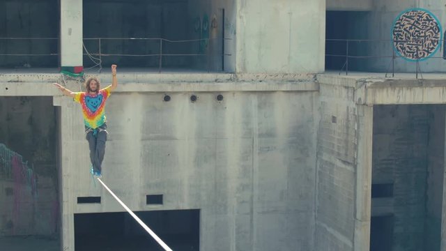 Tightrope walking on a high rope stretched
