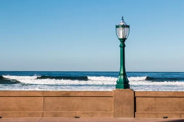 Printed kitchen splashbacks Descent to the beach Lamppost on the Mission Beach boardwalk in San Diego, California with ocean waves in the background.