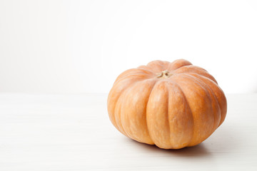 pumpkin on a light wooden background
