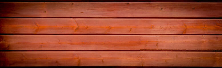 wooden panoramic banner background with a vignette and off center highlight with copy space and texture for your text