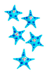Fototapeta na wymiar Group of clay toys (starfish). Isolated on white background, hor