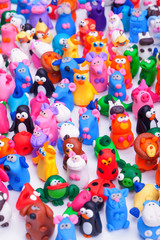 Fototapeta na wymiar Large group of clay toys. Vertical shot