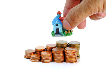 Collect coins for buy a house concept.