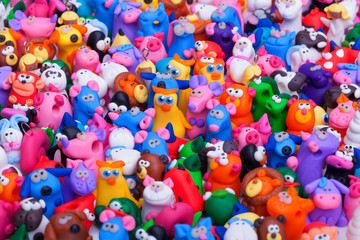 Fototapeta na wymiar Large group of clay toys. Horizontal shot, close up