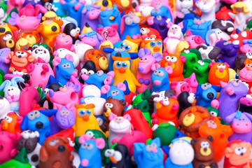 Fototapeta na wymiar Large group of clay toys. Horizontal shot