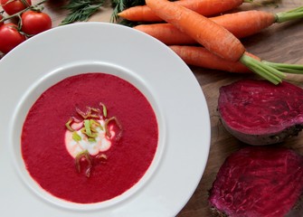 Vegetable soup with red beet, carrots and tomatoes.